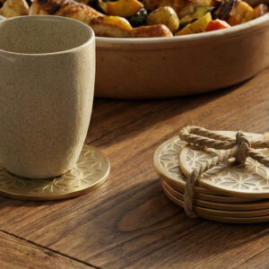 geometric gold coasters set of 6, modern brass tea coaster for dining table, luxury metal drink mats with raised rim, champagne gold table accessories, contemporary home decor gift items, heavy duty coffee coasters for wood table, star pattern coaster set, decorative kitchen table accessories, premium housewarming gifts india, anti skid metal cup holder.