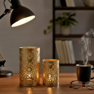 Champagne gold mandala candle holder set Laser cut iron tealight stand for desk Modern study table decor items Diwali lights decoration for home Shadow casting votive gift set Metal cylinder candle holder centerpiece Aesthetic room decor for office table Boho chic gold home accessories Religious festival decoration items Premium rust proof candle jar